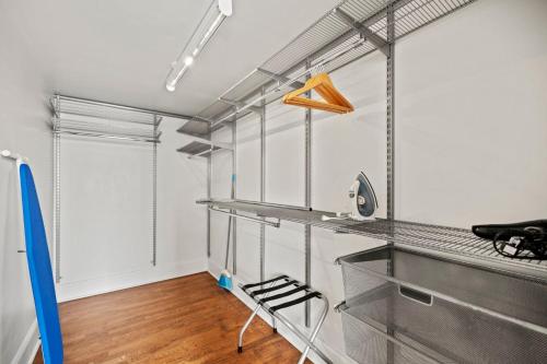 a room with metal shelves and a chair in it at The Maverick, powered by Placemakr - River Walk in San Antonio