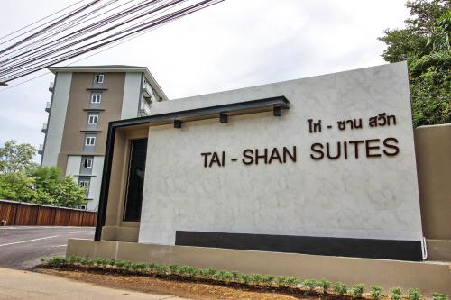 a building with a sign that reads tla shan suites at Tai-Shan Suites in Ratchaburi