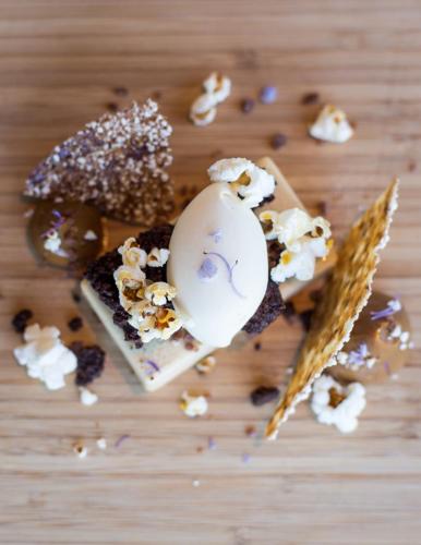 a close up of a piece of food on a table at Rosewood Matakauri in Queenstown