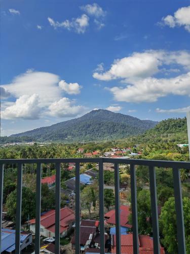 a view of a mountain from a balcony at Homestay Pangsapuri Simfoni 3BR 7Pax Kuah Langkawi in Kuah