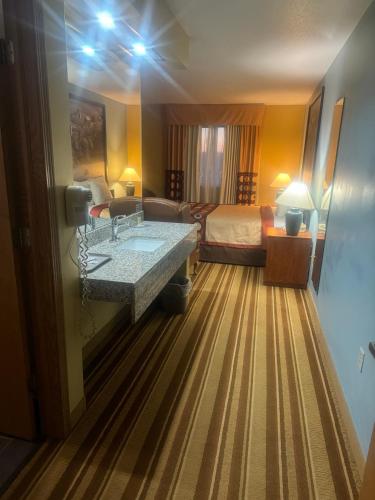 a hotel room with a sink and a bed at Super 8 by Wyndham Sparta in Sparta
