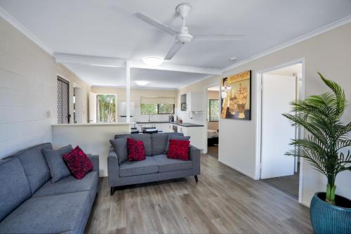 a living room with a couch and a table at Gold Rush Apartments in Gympie