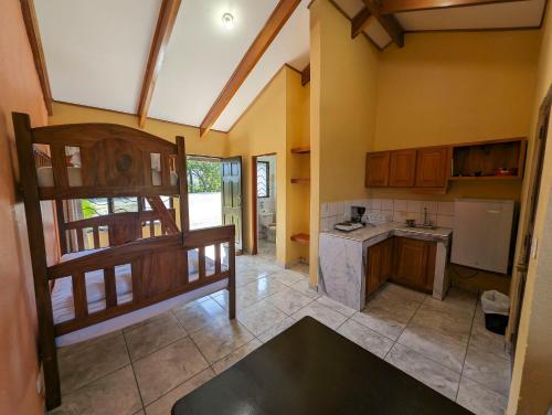 a kitchen with wooden cabinets and a counter top at Cabinas Copal en Copal KiteBeach in Playa Copel