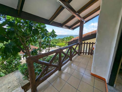 a balcony of a house with a view at Cabinas Copal en Copal KiteBeach in Playa Copel