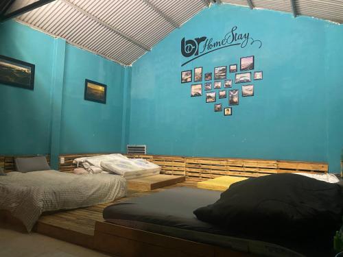Ένα ή περισσότερα κρεβάτια σε δωμάτιο στο Chamlam home stay and coffee(phòng dorm)