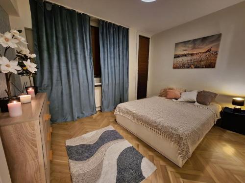 a bedroom with a bed and a large window at KS M Centrum in Warsaw