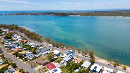 an aerial view of a beach and the water at Fishing and Swimming at your doorstep - Sylvan Beach Esp, Bellara in Bellara