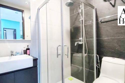 a bathroom with a shower and a toilet and a sink at ABHOME "SKY GARDEN SUITE" #DangaBay #Sea & Garden View #BeachBay #BeletimeMall #JB in Johor Bahru
