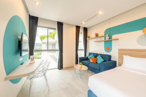Cama o camas de una habitación en HOMA Phuket Town