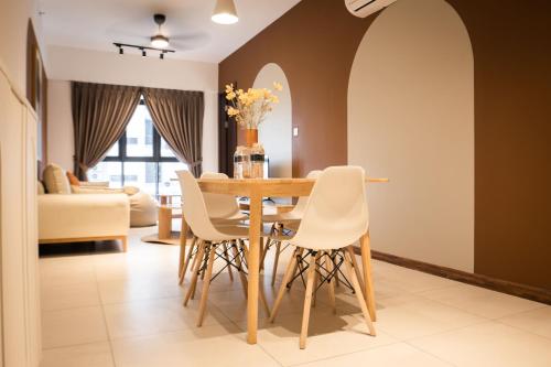 a dining room with a table and chairs at K Avenue by Pinstay in Donggongon