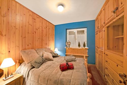 a bedroom with a bed with a red bag on it at Chaberton Romantic Retreat - Happy Rentals in Claviere