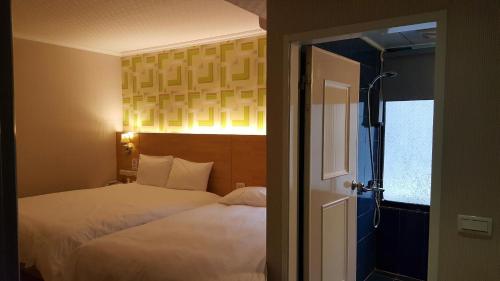 Tempat tidur dalam kamar di Honey Prince