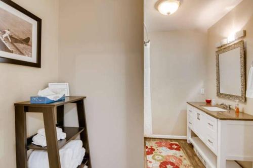 a bathroom with a sink and a mirror at Beautiful 2 Bedroom Unit w/ FAST FREE WIFI in Beaverton
