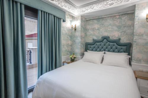 Postel nebo postele na pokoji v ubytování Aelia Luxury Apartments