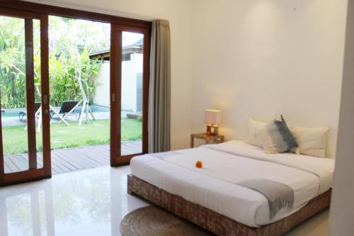 Giường trong phòng chung tại Villa Kim Seminyak
