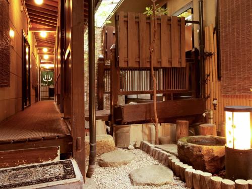 an empty hallway of a building with a hallway at Oyado Yumechidori in Saga
