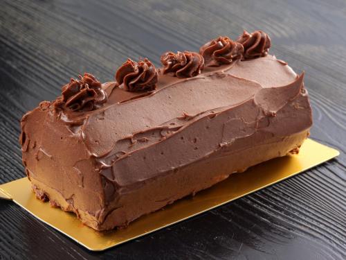 a chocolate cake on a yellow plate on a table at Oyado Yumechidori in Saga