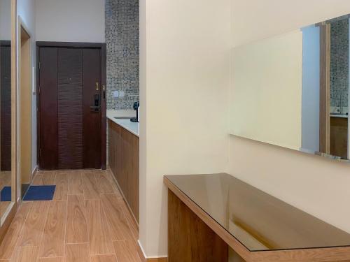 a kitchen with a large sink and a wooden floor at فندق ارجان بارك العزيزية Arjan Park Hotel in Riyadh