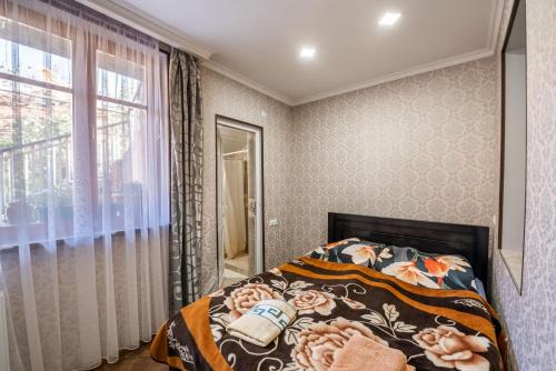 Postel nebo postele na pokoji v ubytování Guesthouse Mtskheta-Kapanadze