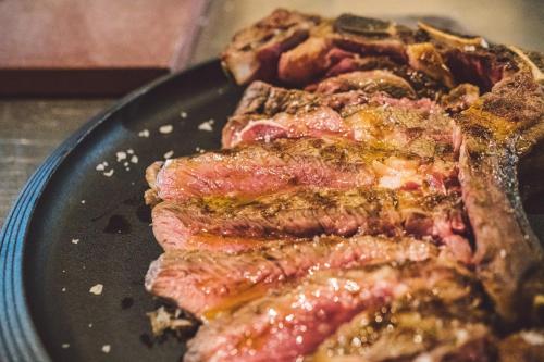 a close up of a plate of food with meat at Due Ponti Village in Cesenatico