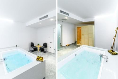 a bathroom with a large tub in a room at 5star Villa Harmony w heated pool, Gym, Spa, Sauna in Skalánion