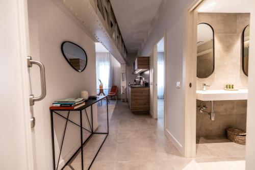 a bathroom with a sink and a mirror at Diana Suites 23 in Málaga