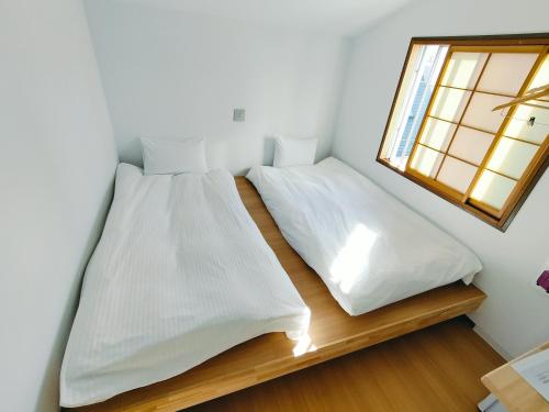 Postel nebo postele na pokoji v ubytování Hostel Belle Via Tokyo