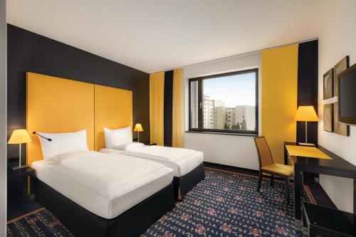 Postel nebo postele na pokoji v ubytování Vienna House Easy by Wyndham Katowice