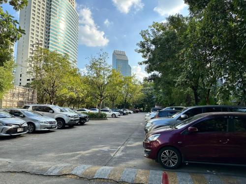 a bunch of cars parked in a parking lot at Calypzo Bangkok in Bangkok