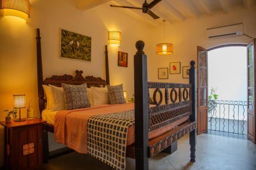 a bedroom with a bed in a room at Residence De L'eveche - Entire Villa in Pondicherry- A CGH Earth SAHA Experience in Puducherry