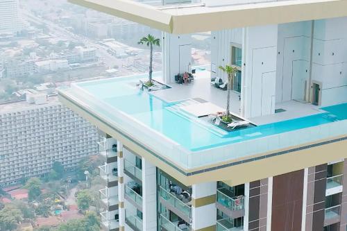 a building with a swimming pool on top of it at Best Place In Jomtien, Breath Taking Views in Jomtien Beach