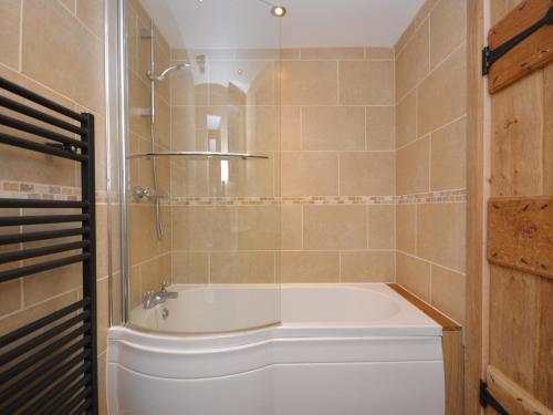 a bathroom with a bath tub and a shower at 1 Bed in Coleford 37217 in Bream