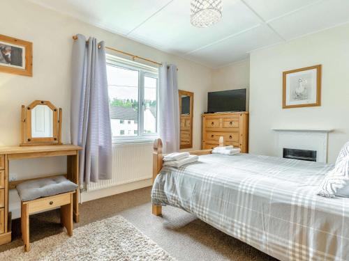 a bedroom with a bed and a window at 2 Bed in Kielder 89299 in Falstone