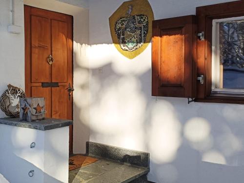 a kitchen with a wooden door and a counter top at Chalet M in Davos