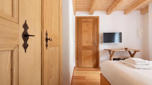 TV o dispositivi per l'intrattenimento presso Bear Hutte - Bormio & Livigno luxury stay