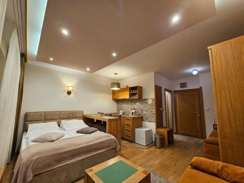 Ένα ή περισσότερα κρεβάτια σε δωμάτιο στο Apartments Rapid