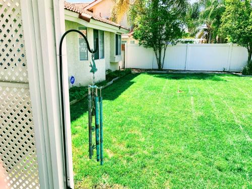 a view of a yard from a window of a house at Silver Sands Den in Hemet