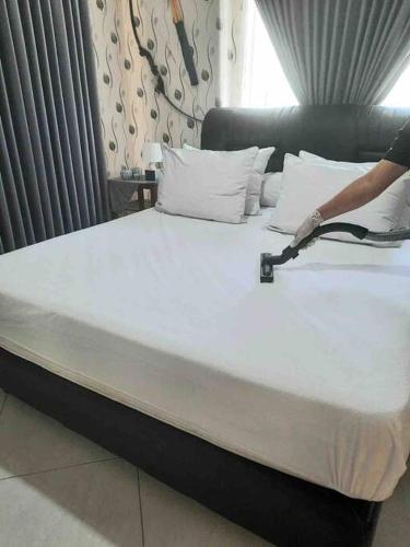 a close up of a large bed in a room at The Sangtus Home in Babakan Madang