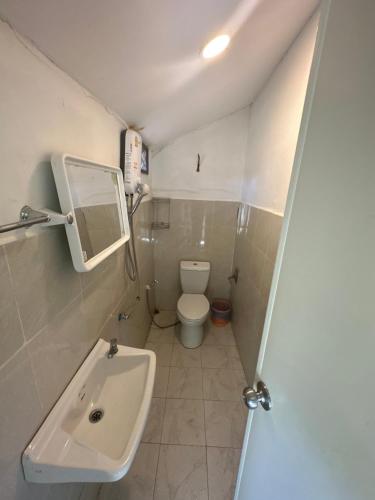 a small bathroom with a sink and a toilet at Lonely beach complex titanic hotel in beach shopping street markets ในศูนการค้าติดทะเล in Khlaung Phai Bae