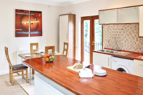 a kitchen with a wooden counter top in a room at The Atholl Palace in Pitlochry