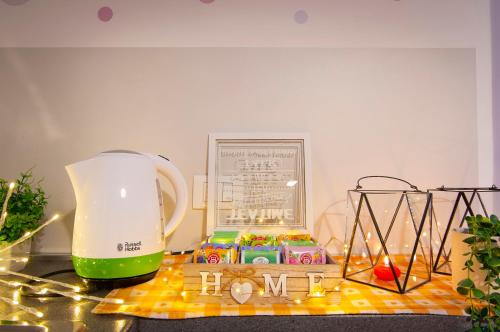 a kitchen counter with a blender and some candles at Borgo Trento Home, vicinissimo ospedale Borgo Trento e centro storico in Verona