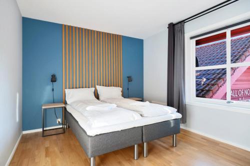 Postel nebo postele na pokoji v ubytování Flåm Station Apartments