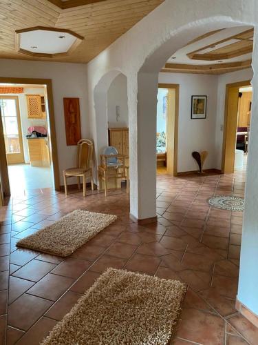 a living room with two rugs on the floor at Appartement Pargger in Stumm