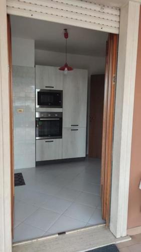 a kitchen with stainless steel appliances in a room at Roma e Palazzo Pontificio di Castel Gandolfo-Vaticano in Rome