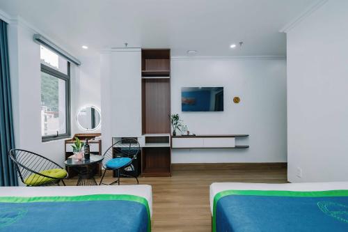 Телевизор и/или развлекательный центр в TOMMY HOTEL