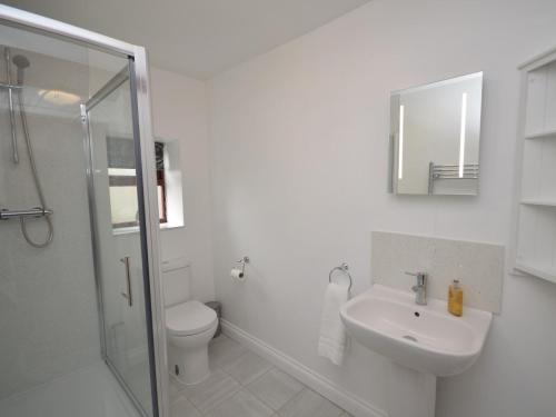 a white bathroom with a toilet and a sink at 2 Bed in Bath 56550 in Stowey