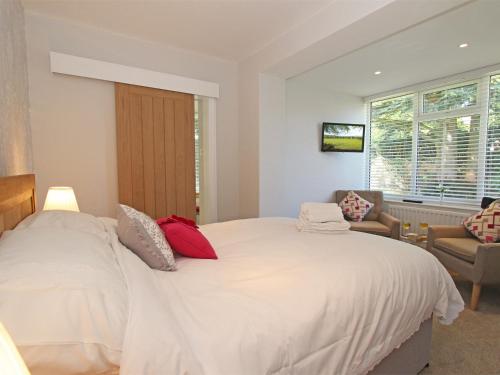 a bedroom with a large white bed and a window at 1 Bed in Nr Hexham CN196 in Wall