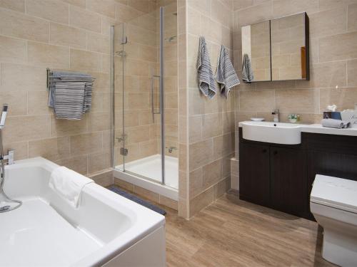 a bathroom with a tub and a sink and a shower at 1 bed property in Durham CN208 in Lanchester