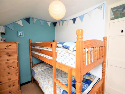 a childs bedroom with two bunk beds at 3 bed property in Mundesley KT043 in Mundesley
