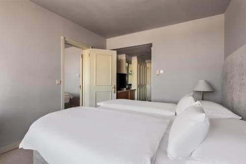 Cama o camas de una habitación en Exe Lev